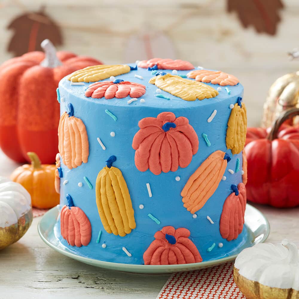 blue cake with buttercream pumpkins