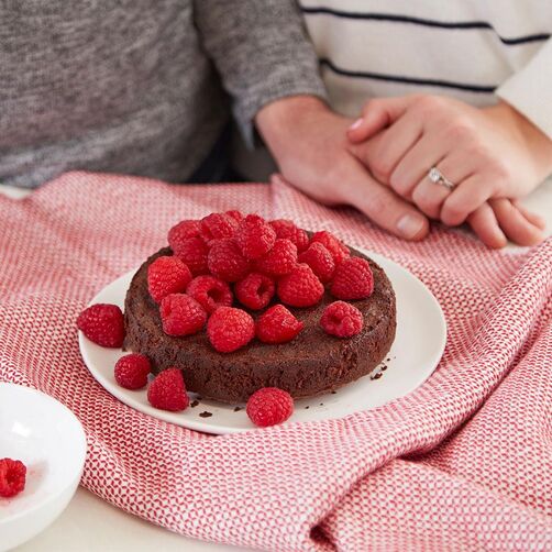 Chocolate lava cake topped with fresh raspberries