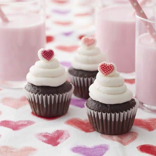 Mini Valentine's Day cupcakes topped with a candy heart