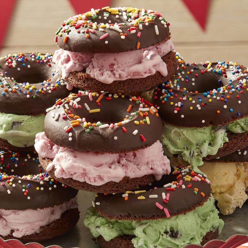 Chocolate donuts sandwiches with ice cream in the middle