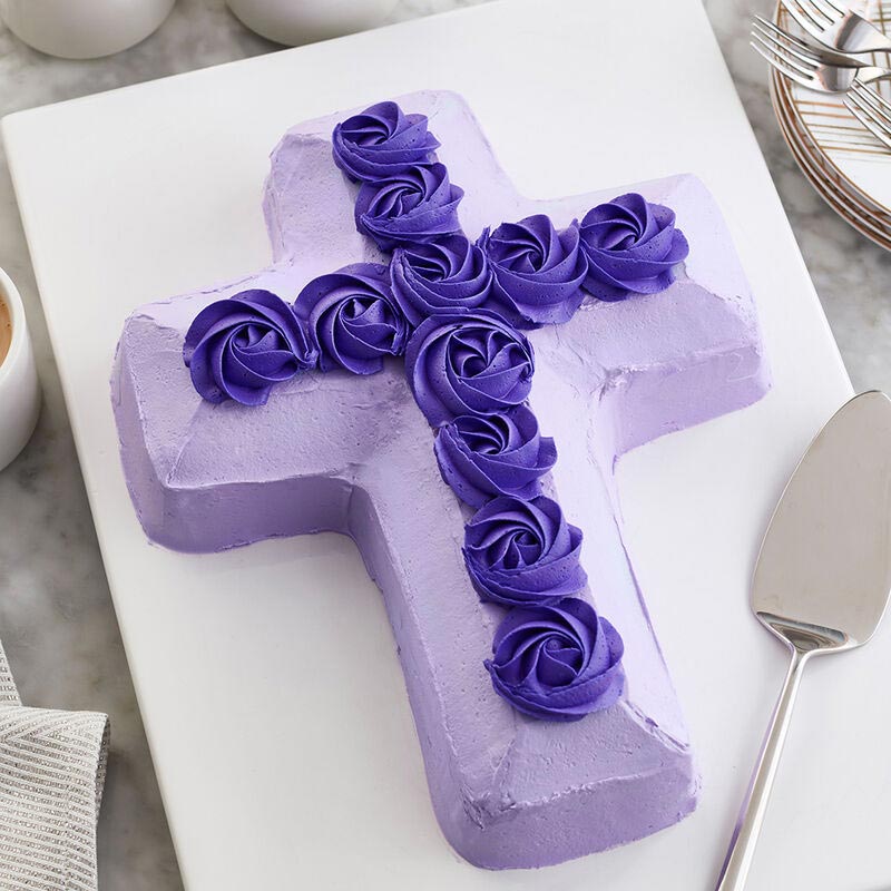 Purple cross cake with dark purple rosettes