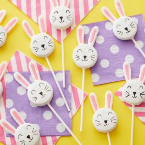 sandwich cookies on sticks decorated with bunny faces