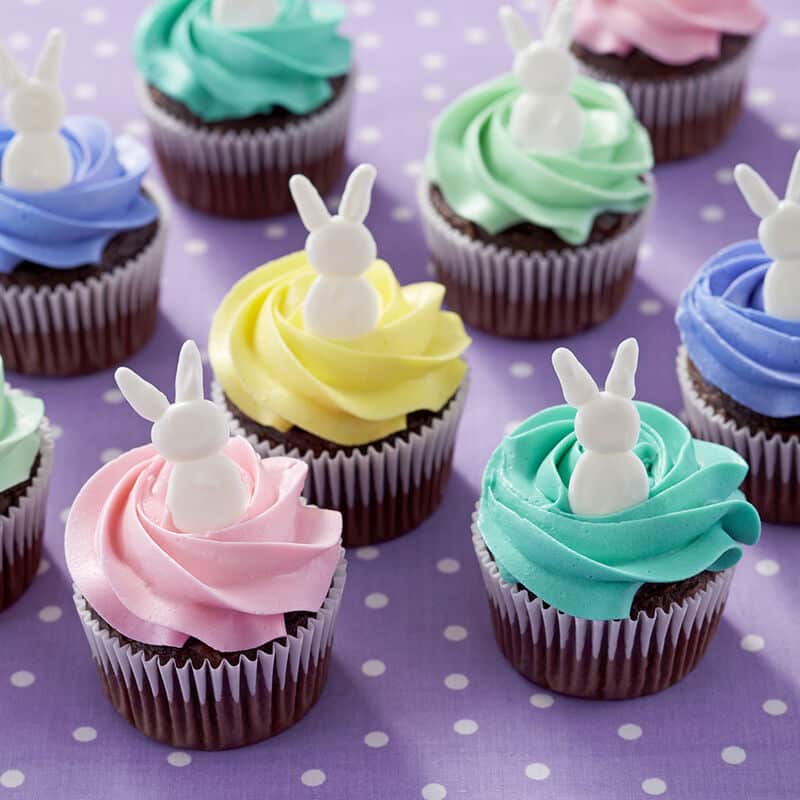 https://blog.wilton.com/wp-content/uploads/sites/2/2020/03/bunny-topped-cupcakes.jpg