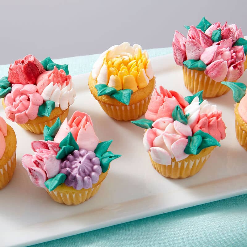 cupcakes decorated with floral blooms