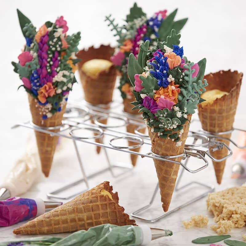 ice cream cones decorated with spring floral frosting