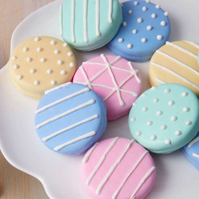 sandwich cookies decorated with dots and stripes made from candy melts candy