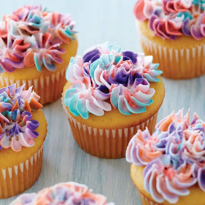 cupcakes topped with colorful buttercream swirl