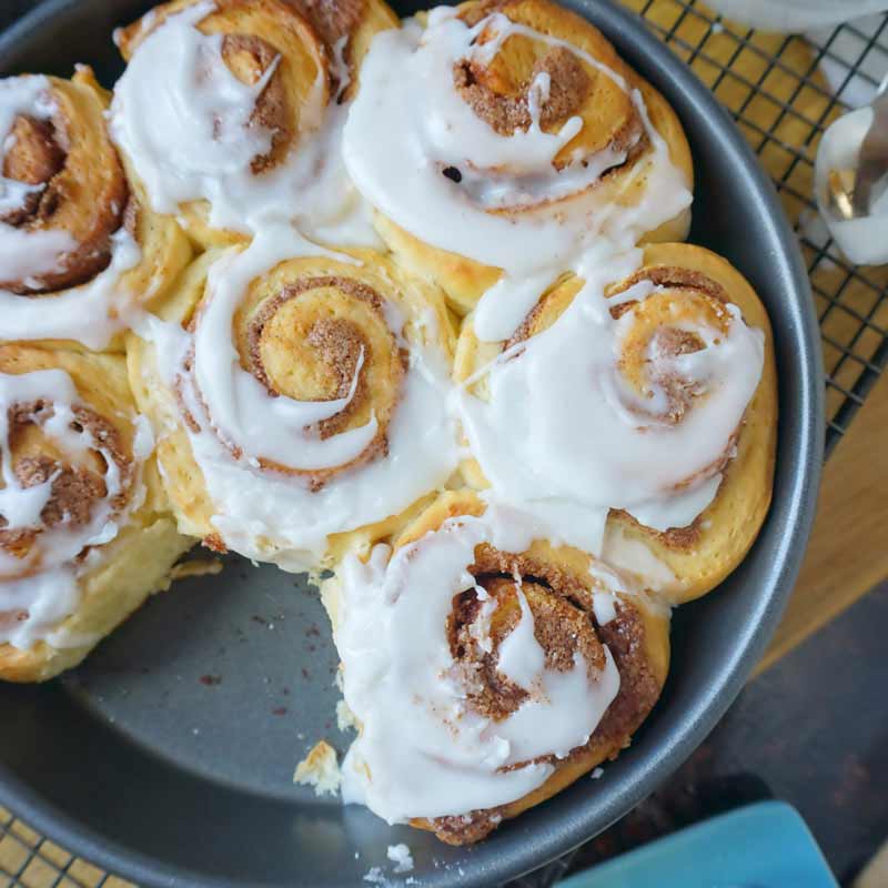 glazed cinnamon rolls in a pan