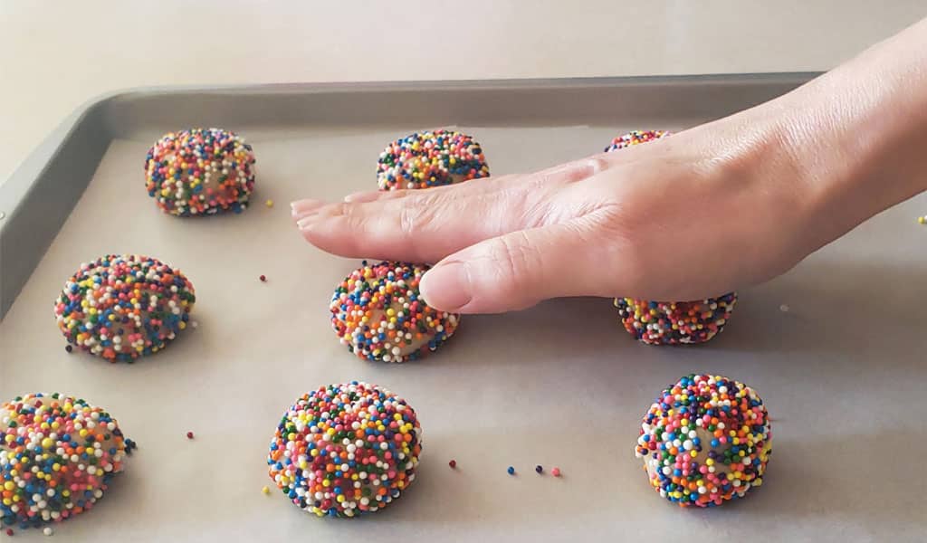 step 8 press cookie dough with sprinkles out flat