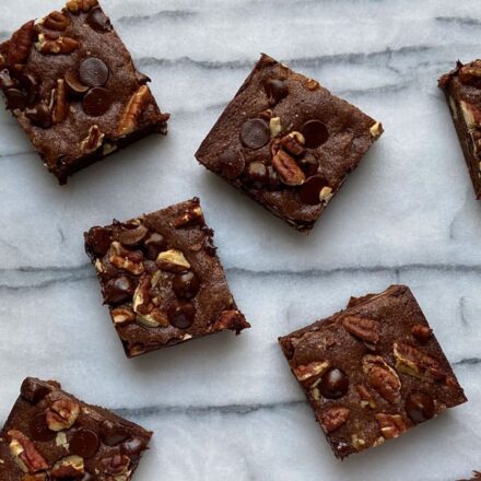 one bowl brownie recipe video title card with image of chocolate chip and walnut brownies