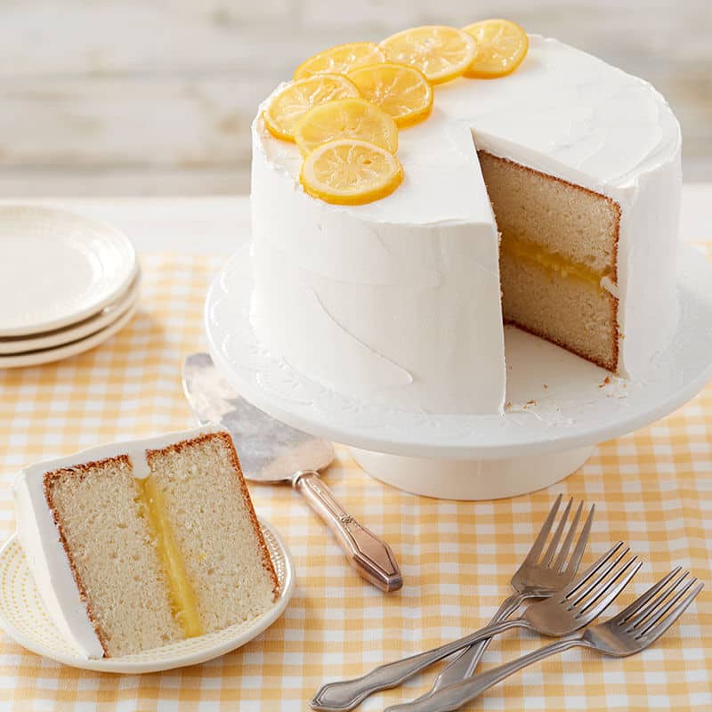 white buttercream frosted cake with lemon filling