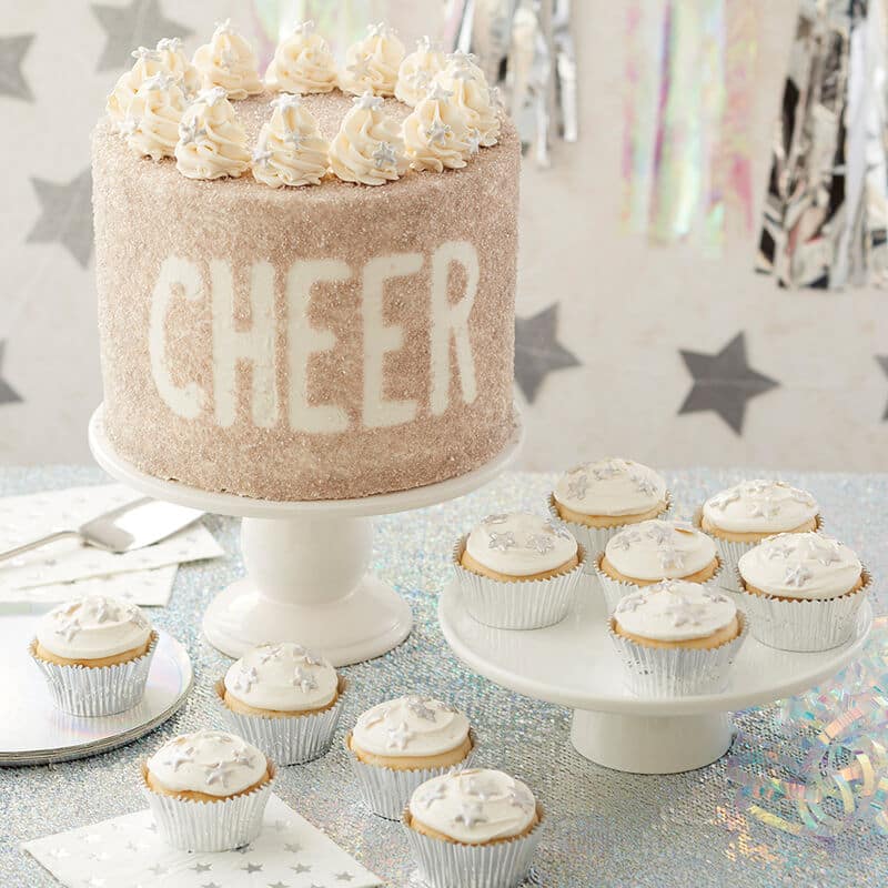 rolled sprinkle cheer cake with white buttercream