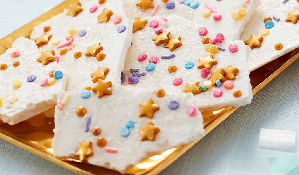 Unicorn candy bark, using white candy melts and an assortment of sprinkles