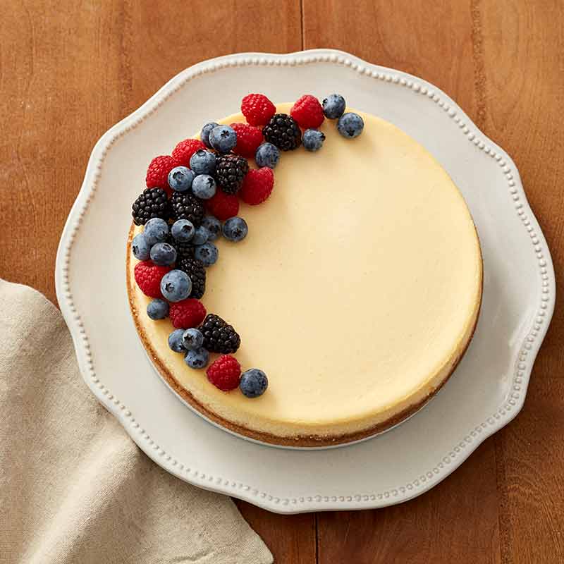 classic cheesecake topped with berries