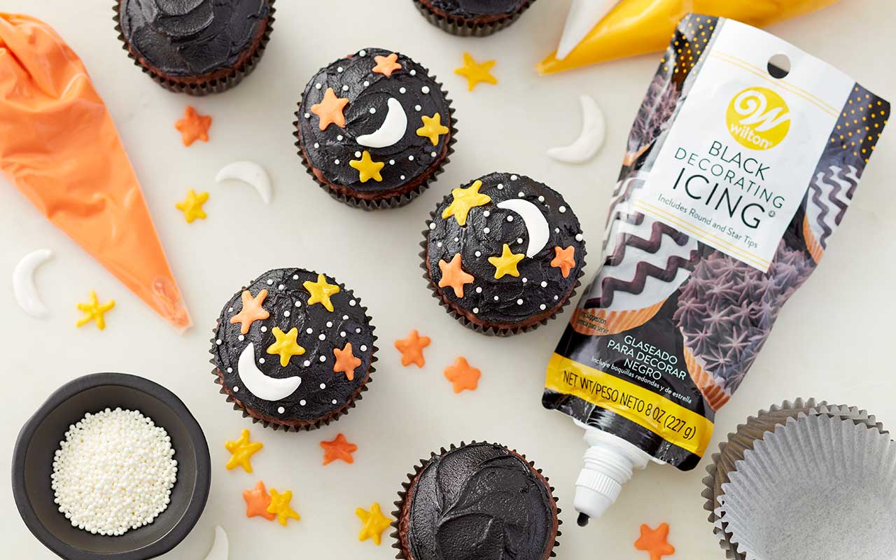 https://blog.wilton.com/wp-content/uploads/sites/2/2021/05/candy-melts-moon-stars-cupcakes.jpg