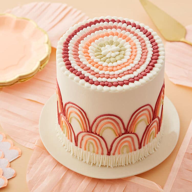 https://blog.wilton.com/wp-content/uploads/sites/2/2021/06/Boho-Rainbow-Cake-1.jpg